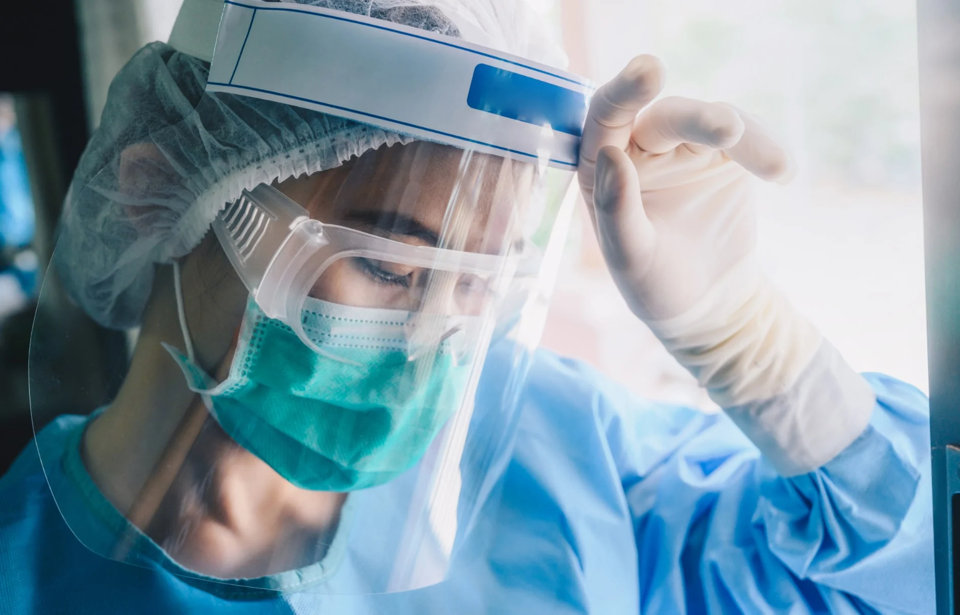 Nurse tired and with headache from wearing PPE