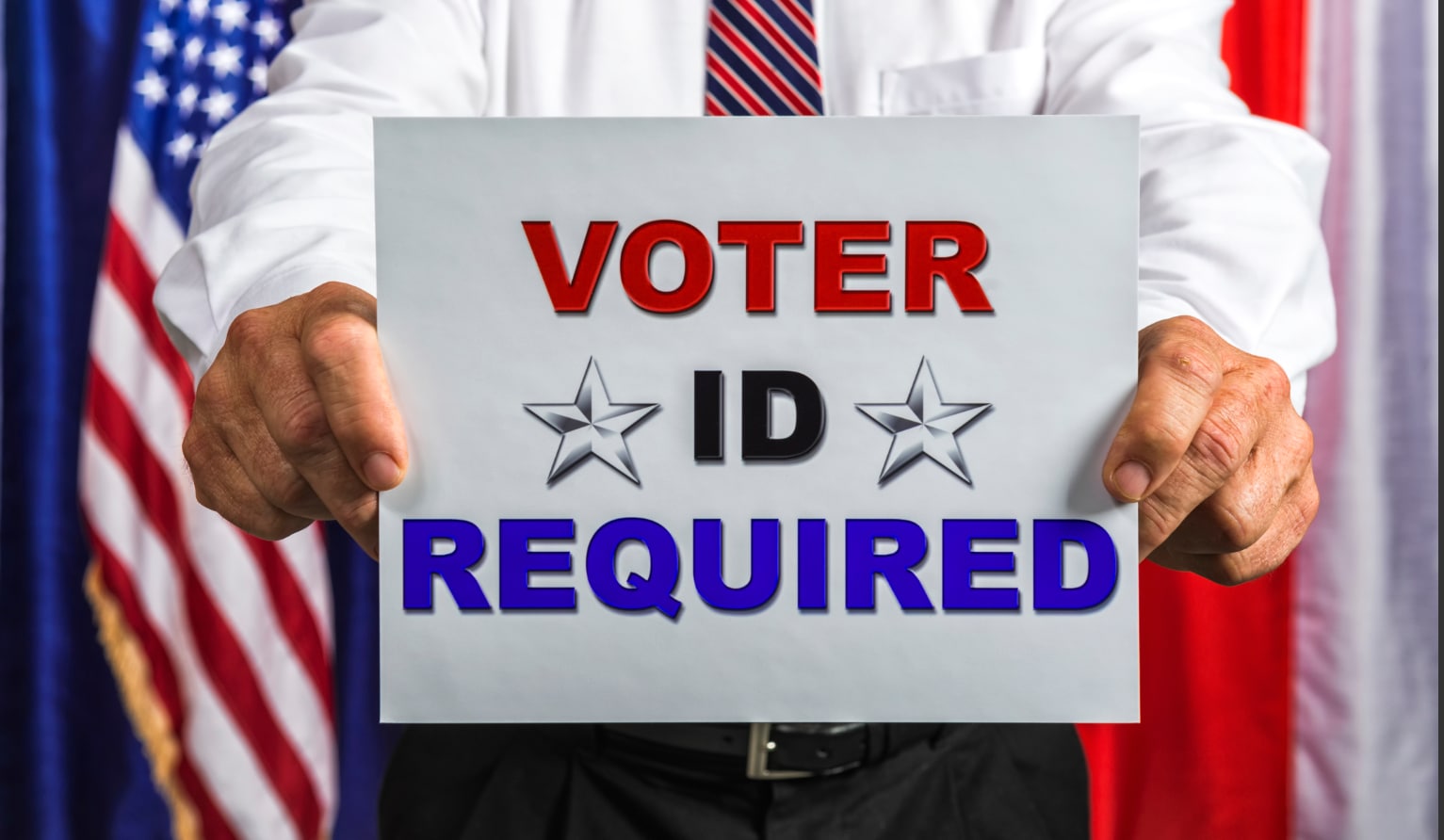 Man holding "Voter ID Required" sign