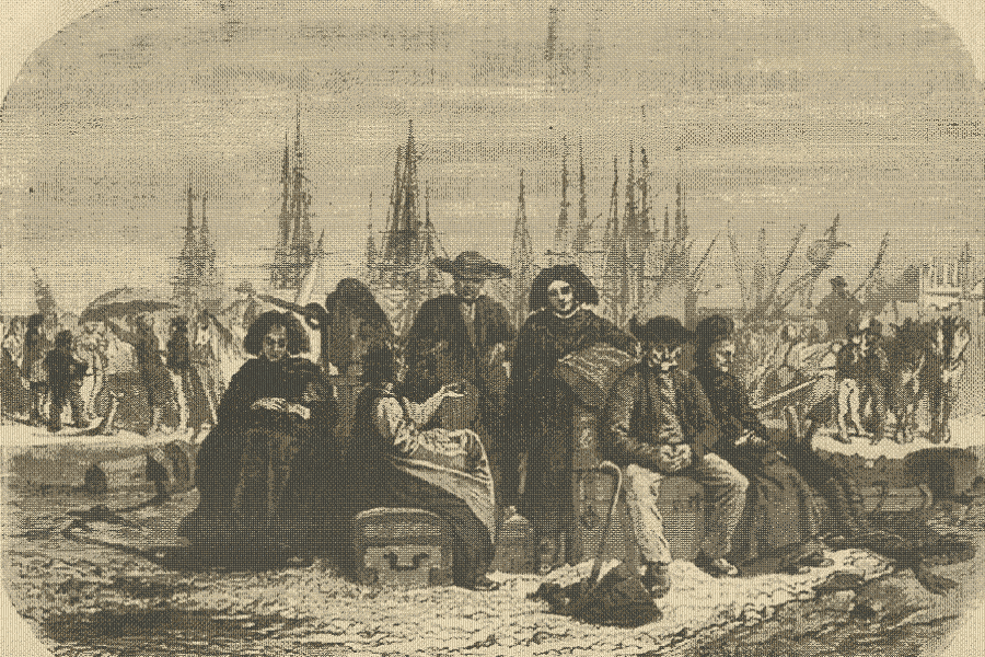 People sitting on trunks with a harbor full of the masts of ships behind them